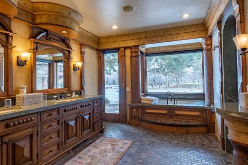 a bathroom with a large sink and a large window at Apres Lodge 5 Bedroom in Hailey