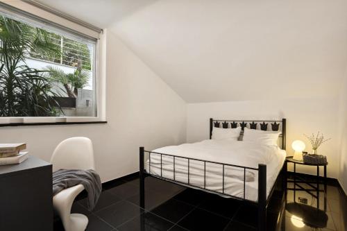 Ένα ή περισσότερα κρεβάτια σε δωμάτιο στο Apartmaji Portorož - Portorož Mansion Suites