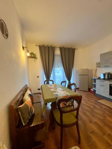 a living room with a table and a couch at Casita in Radda in Chianti