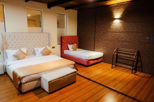 Postel nebo postele na pokoji v ubytování Royal Retreat ,Kandy