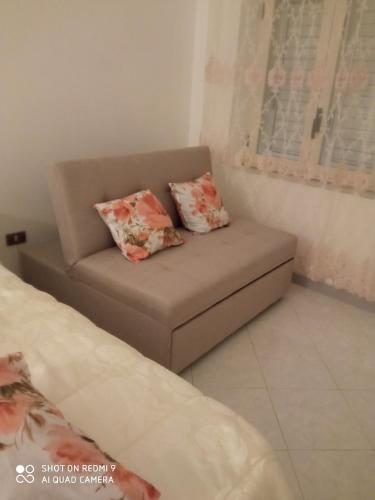 a couch in a room with two pillows on it at Belvedere di Caiazzo in Caiazzo