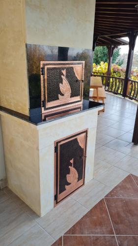 a fireplace in a room with a patio at Bizim Ev in Sapanca