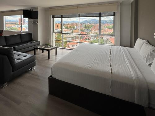 Postel nebo postele na pokoji v ubytování Gaviota Apartments & Suites