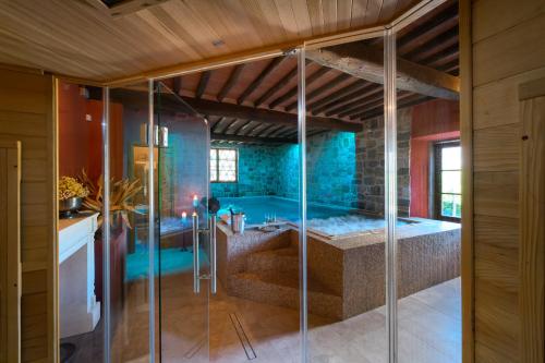 a large bathroom with a tub and a shower at Il Casello Country House in Greve in Chianti