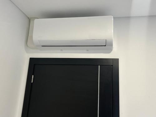 a overhead air conditioner above a door in a room at Home S&F- Ponte de Vagos in Ponte de Vagos