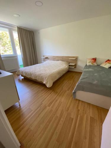 Ένα ή περισσότερα κρεβάτια σε δωμάτιο στο Apartament Lidia