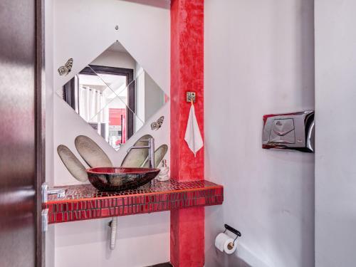 a bathroom with a mirror and a bowl on a shelf at 5-Star feel - Luxury penthouse for 4 with huge balcony & view ,8 min from Athens airport in Koropíon