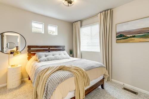 a bedroom with a bed and a window at 13 Mi to Dtwn Denver Spacious Home with Balcony! in Denver