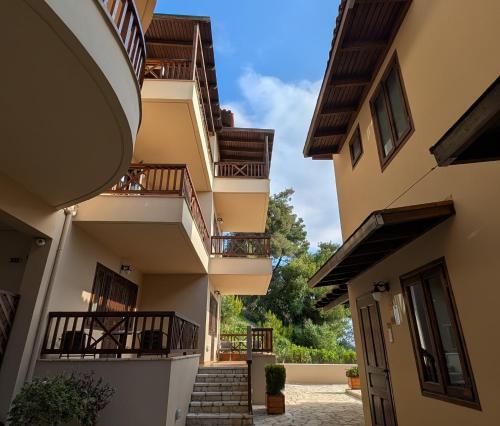 a view of a building with stairs and balconies at Althea Apartments in Katakolon