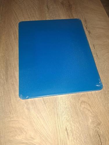 a blue laptop sitting on top of a wooden table at 4 Rooms Piata Sfatului in Braşov