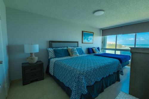 Postelja oz. postelje v sobi nastanitve Lovely 2-2 Condo with the best view of Puerto Rico
