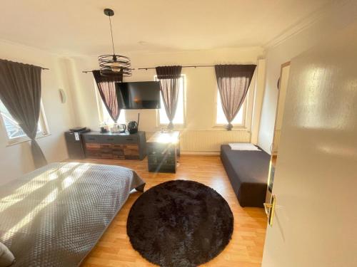 TV a/nebo společenská místnost v ubytování Junges Appartement