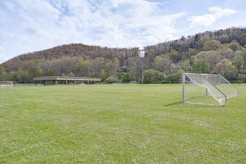 a soccer goal in a field with a building at Hike and Fish Marlinton Cabin with Fire Pit and Views! in Marlinton