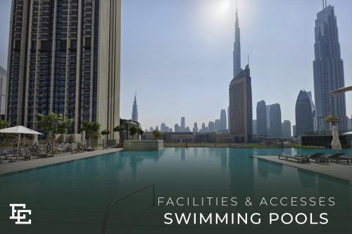 a swimming pool in the middle of a city at Elite Escape Holiday Home - 2 BHK Getaway with Burj Khalifa View and Dubai Mall Access - 1507 in Dubai