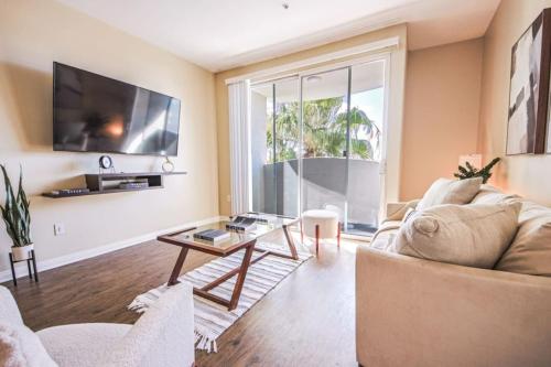 a living room with a couch and a table at Spacious 2BDR Condo near Venice Beach in Los Angeles