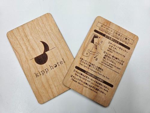 two wooden signs with an apple logo on them at Kipp Hotel Shonan Fujisawa - Vacation STAY 05494v in Fujisawa
