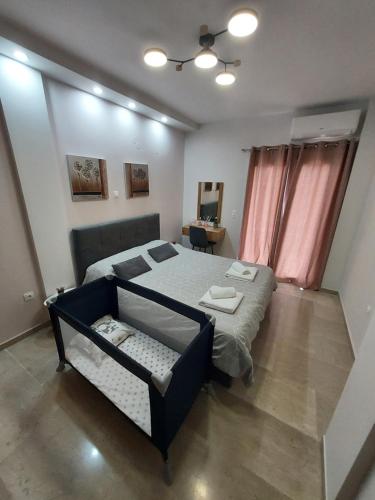 a bedroom with a large bed in a room at Elena's Place, free parking!!! in Perea
