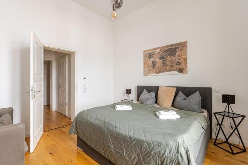 a bedroom with a bed with two towels on it at Wohnen wie im Schloss - Alter Bahnhof von Kruft in Kruft