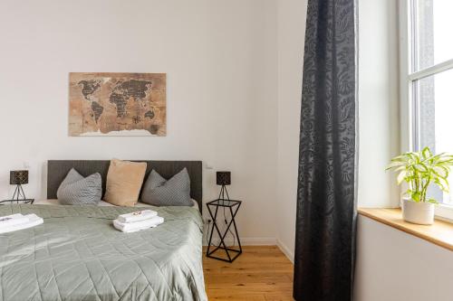 a bedroom with a bed and a window at Wohnen wie im Schloss - Alter Bahnhof von Kruft in Kruft