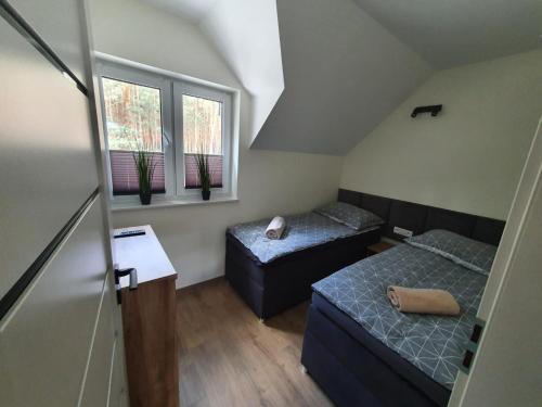 Postel nebo postele na pokoji v ubytování Apartament Sielpia DeLuxe 2