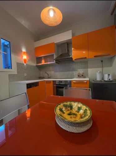 a kitchen with a table with a plate of food on it at AurantiaSuites in Koroni