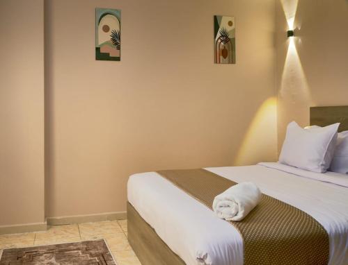 Katil atau katil-katil dalam bilik di Roadhouse New Cairo Residence
