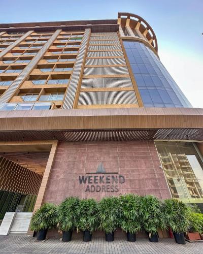 a building with a sign that reads west end address at Weekend Address in Dumas