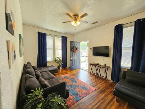 a living room with a couch and a television at Cool and calm place to live in Memphis