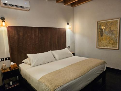 Postel nebo postele na pokoji v ubytování MariaBonita Petit Hotel