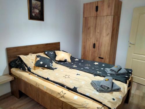 a bedroom with a bed with stars on it at Apartman Nada in Jagodina
