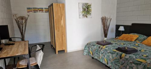 Ένα ή περισσότερα κρεβάτια σε δωμάτιο στο Bed and Breakfast 't Klokhuis