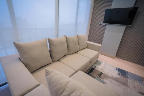 TV a/nebo společenská místnost v ubytování Loft moderno de lujo junto a UTPL