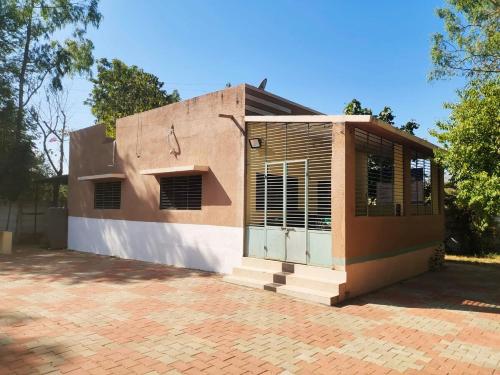 a building with a door on the side of it at The Heaven - Farms & Resorts in Ānakhol