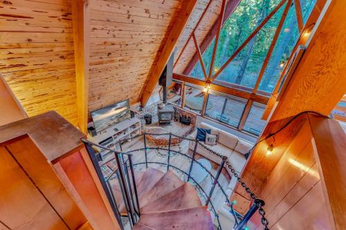an overhead view of a spiral staircase in a house at 3BR Tahoe Cabin in the Trees with Hot Tub in Carnelian Bay