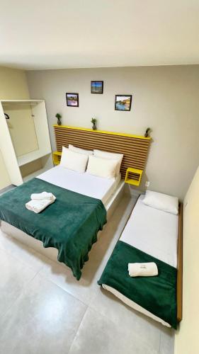 Postel nebo postele na pokoji v ubytování Flat Chamego Triplo