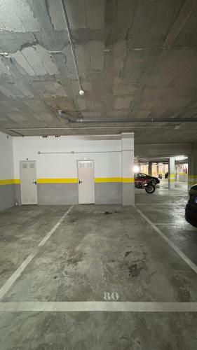 an empty parking garage with a car parked in it at Luna home in Torrox