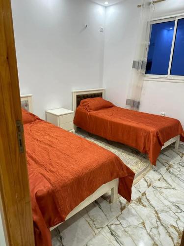 Кровать или кровати в номере Mahdia Apartment N1 Chic et Modern