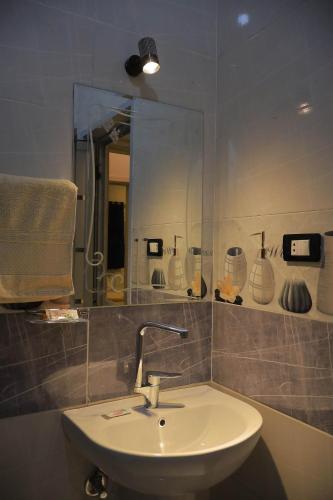 a bathroom with a sink and a mirror at Rayan Nubian Guest House in Aswan