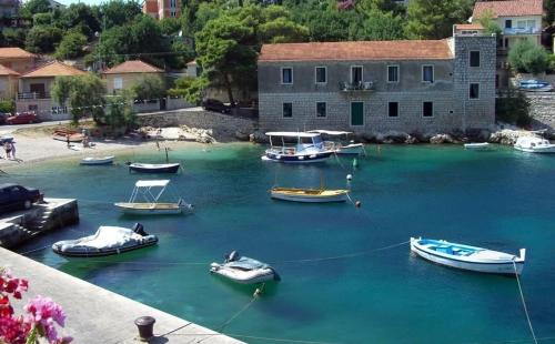 a group of boats in a body of water at Milton holiday house in Blato