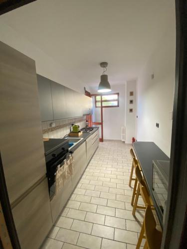 a kitchen with a stove and a counter at Misani Apartments in Novara