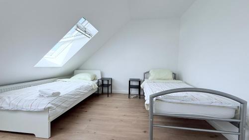 Zentrale Apartments in Rendsburg ideal für Monteure & Geschäftsreisendeにあるベッド