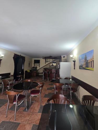 a room with tables and chairs and a stage at Ritsa Boutique Hotel in Batumi