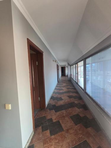 an empty hallway of a building with a door at Ritsa Boutique Hotel in Batumi