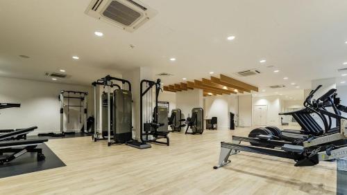a gym with several treadmills and machines in a room at Stunning Apartment with Private Terrace in London