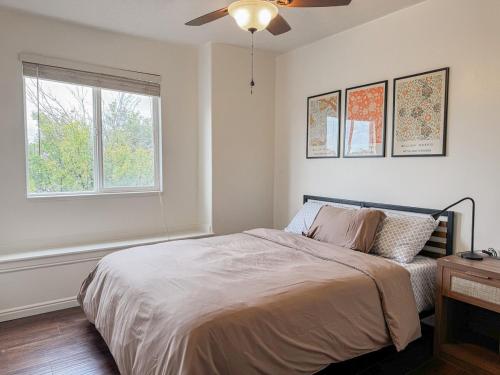 a white bedroom with a bed and a window at Family Retreat Near SLC Airport 6 BR 3 Bath in West Valley City