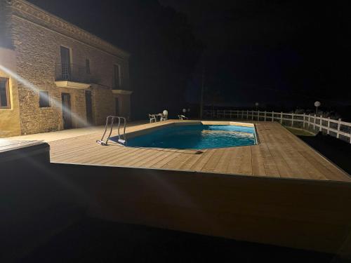 a swimming pool at night next to a building at Za Teresa - Napoleonic Private Resort & Spa - Entire property only in Giuliano Teatino