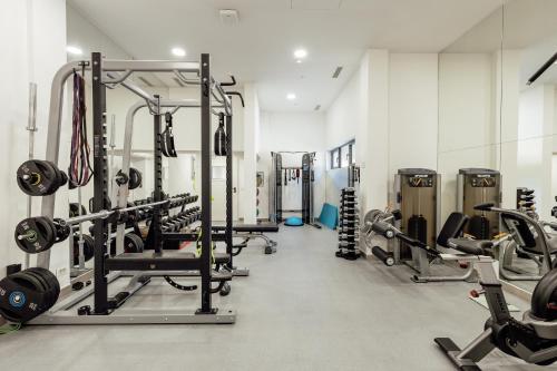 a gym with several treadmills and weights at Porto Montenegro in Tivat