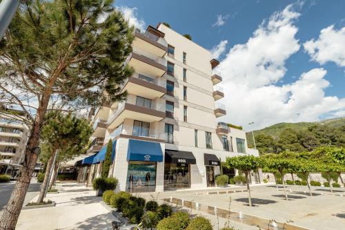 a building with a tree in front of it at Porto Montenegro in Tivat