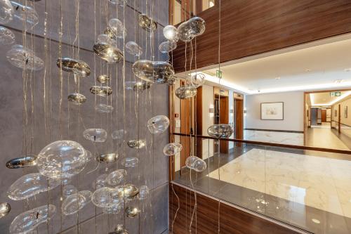 a bunch of bubbles hanging from a wall at Porto Montenegro in Tivat