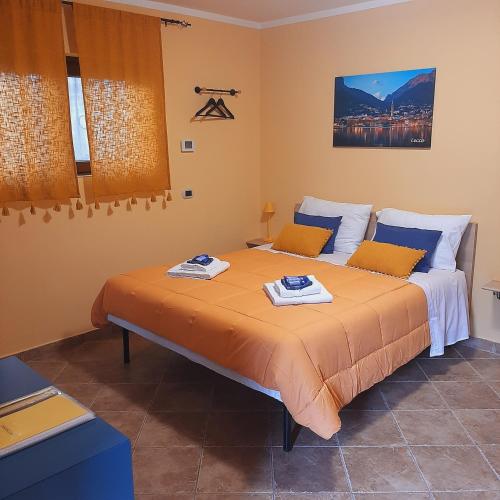 a bedroom with two beds with towels on them at Il PETTIROSSO in Galbiate